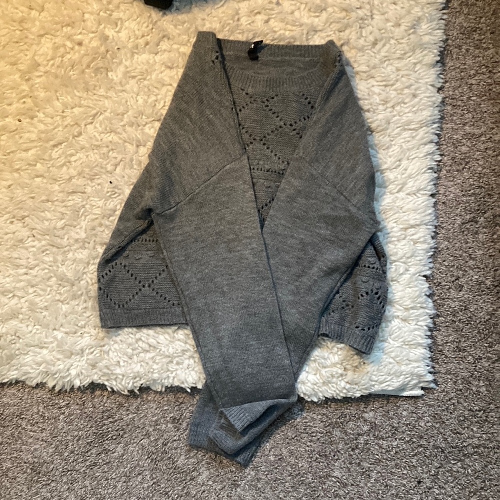 Grey women’s crop off the shoulder sweater.